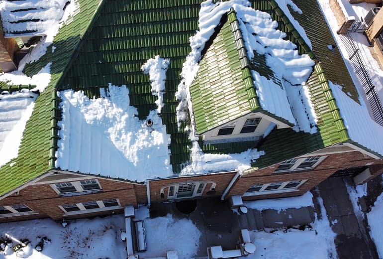 Snow melting on roof means checking roof for winter damage