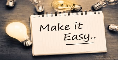 Make it easy written on a note pad with lightbulbs around it