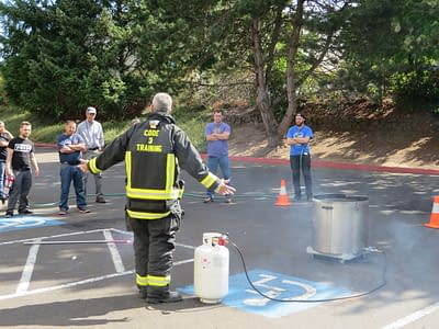Code 3 Safety & Training instructor teaching proper use of fire extinguishers