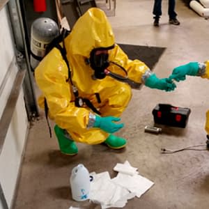 Hazmat crew testing unknown chemicals during training course