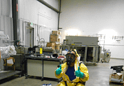 Hazardous materials training instructor in hazmat suit