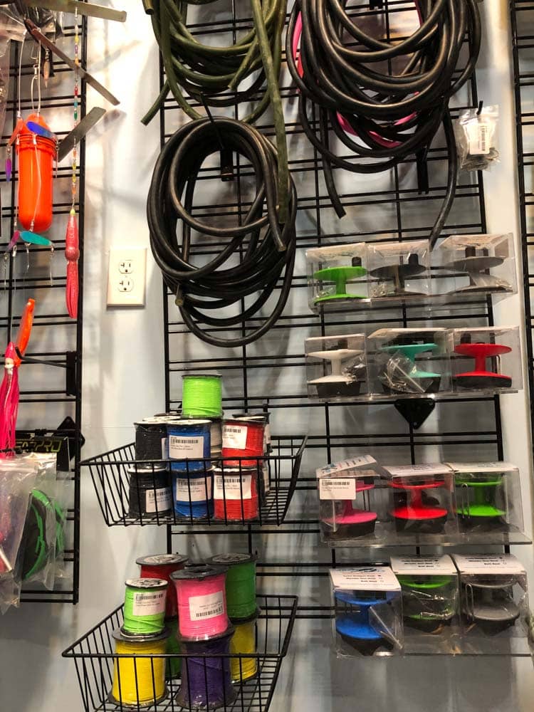 speafishing equipment on the store wall display