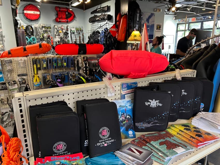 display with dive log books and spearfishing floats