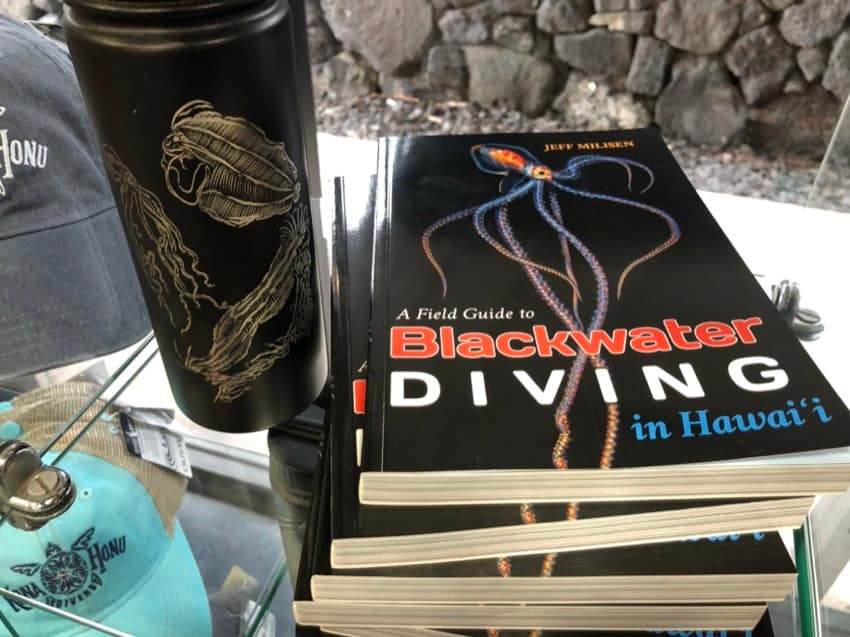 blackwater dive book and fifty fifty flask on shelf