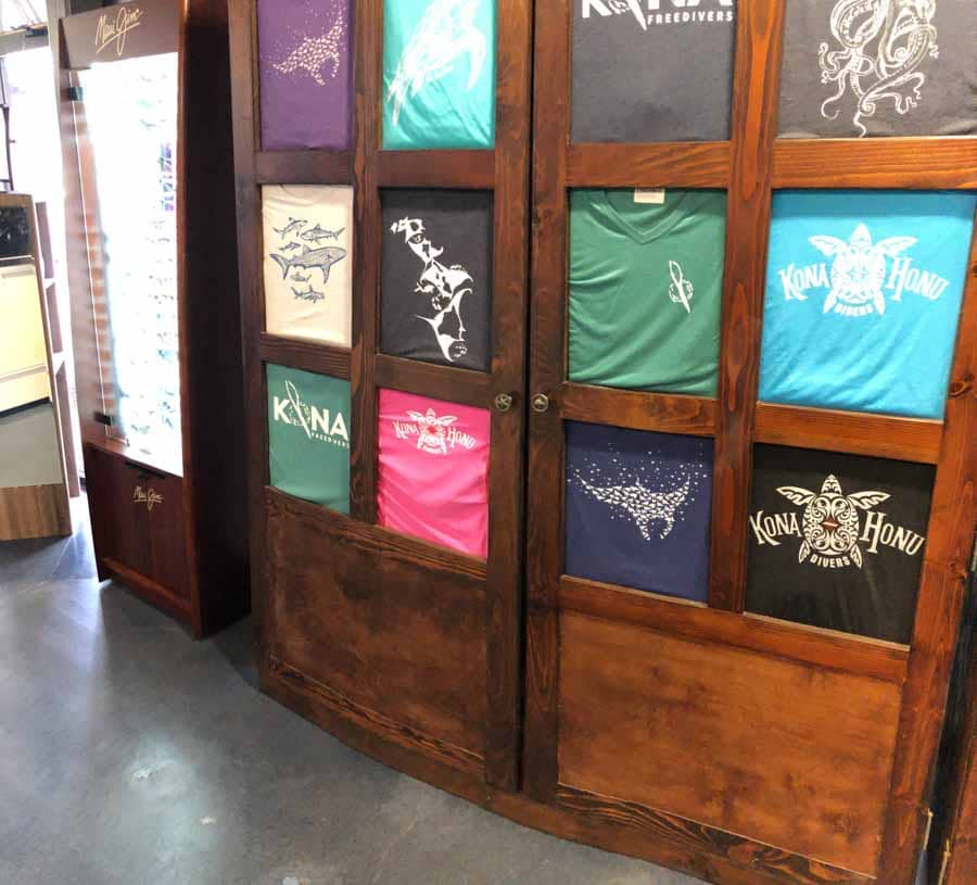 dive shop interior shirt display wood cabinet