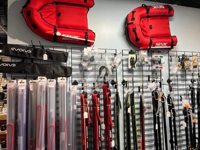 lots of spearfishing gear inside a dive shop