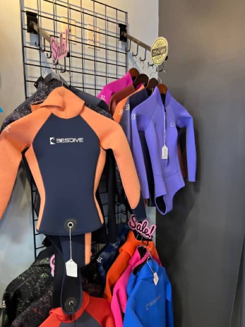 wetsuits inside a dive shop