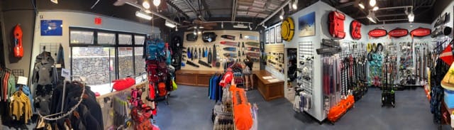 panoramic of middle of dive shop with products all around