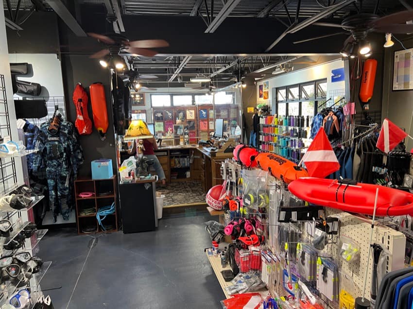 inside of dive shop with products on display in foreground