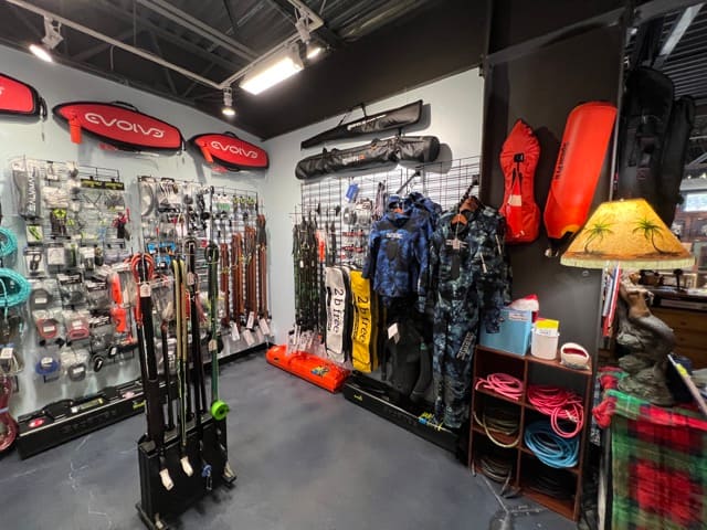 inside a dive shop spearfishing gear corner