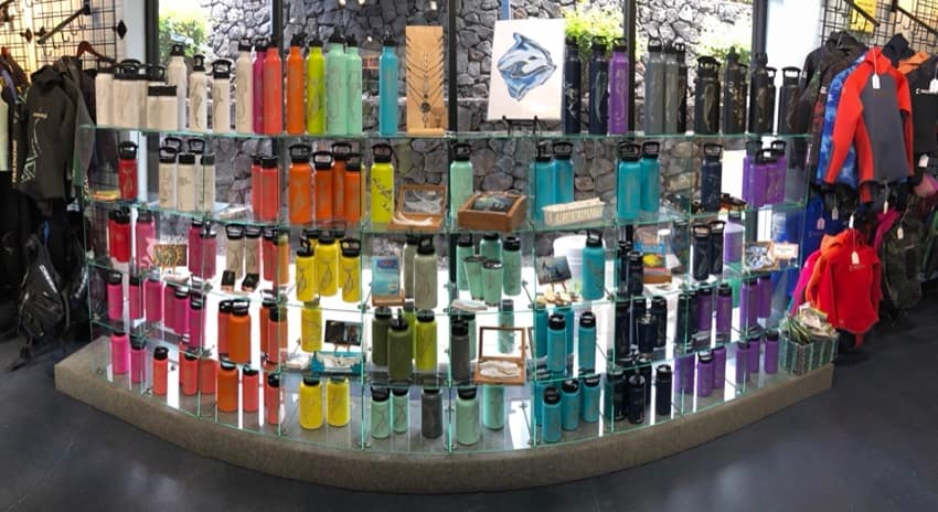fifty fifty flasks in glass display case