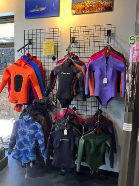 wetsuits inside a sidve shop