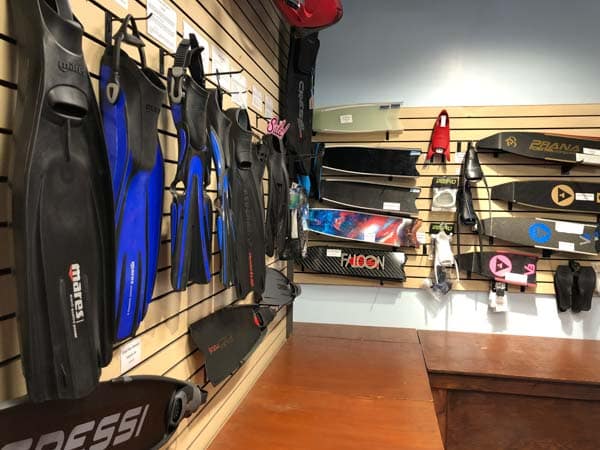 scuba and snorkel and freediving fins on the wall