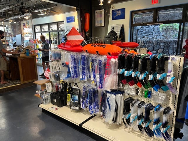 inside of dive shop products on display including snorkels