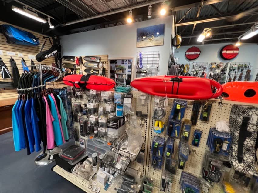 inside dive shop with products on display like floats and accessories