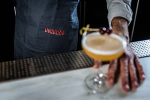 bartender serving a cocktail