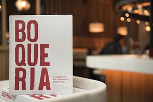 Spanish cookbook from executive chefs Marc Vidal and Yann de Rachefort upright on a table