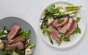 Seared lamb with grilled asparagus available at Boqueria tapas bar in NYC and DC.