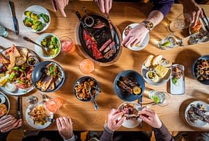 A private dining group sharing various tapas plates at Boqueria Dupont Circle