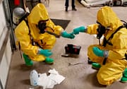 Hazmat crew testing unknown chemicals during training course