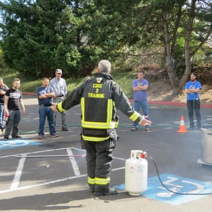 Code 3 Safety & Training instructor teaching proper use of fire extinguishers