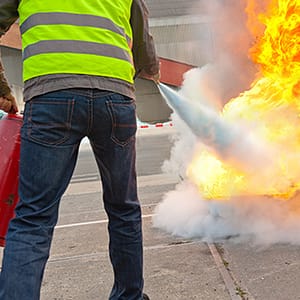 Code 3 Safety & Training instructor teaching proper use of fire extinguishers