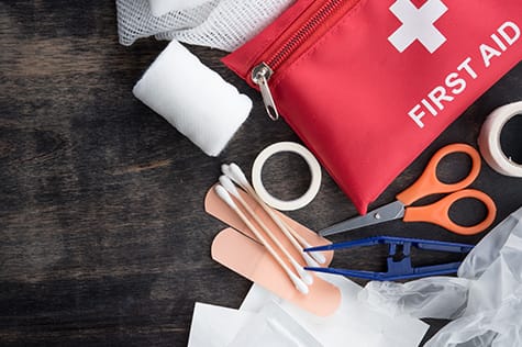 first aid kit laid out on table