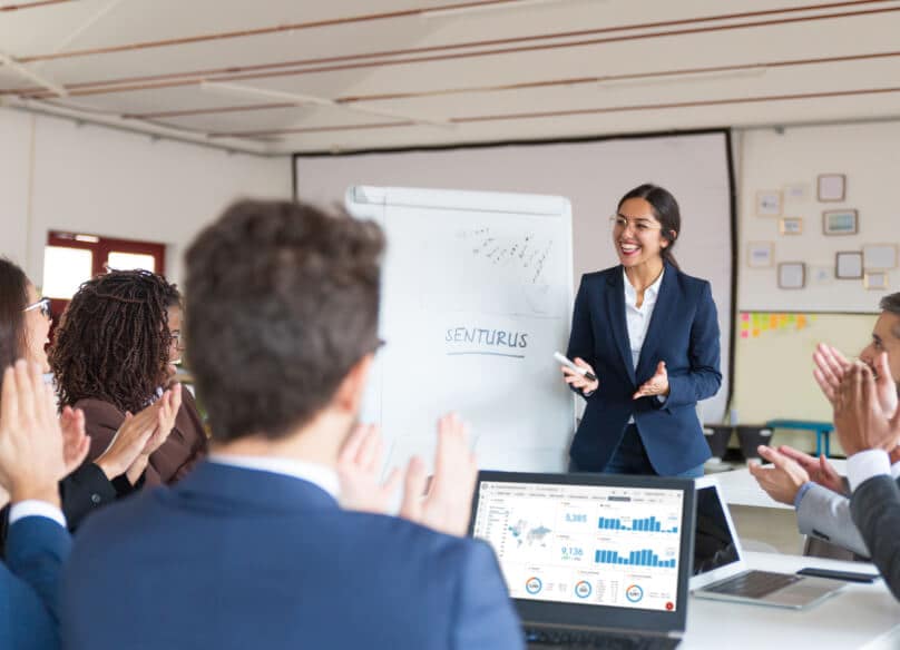 Woman teaching in front of whiteboard