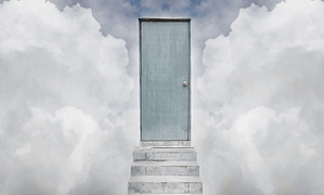 Cement stairs leading to a gray door with clouds on either side