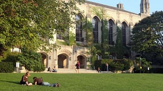 Deering library at Northwestern University with students on the lawn
