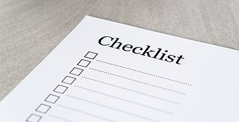 Checklist written on white paper