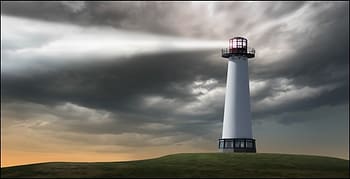 Lighthouse on top of a grassy hill