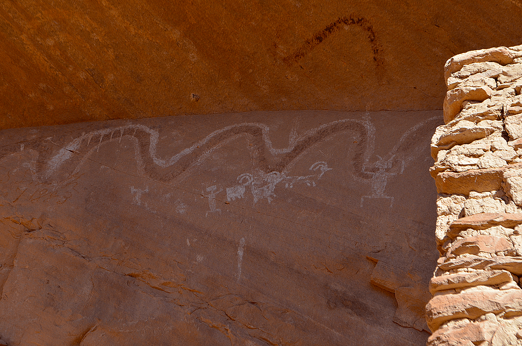 The serpent-like pictograph on the wall above the River House Ruin potentially carries multiple meanings.