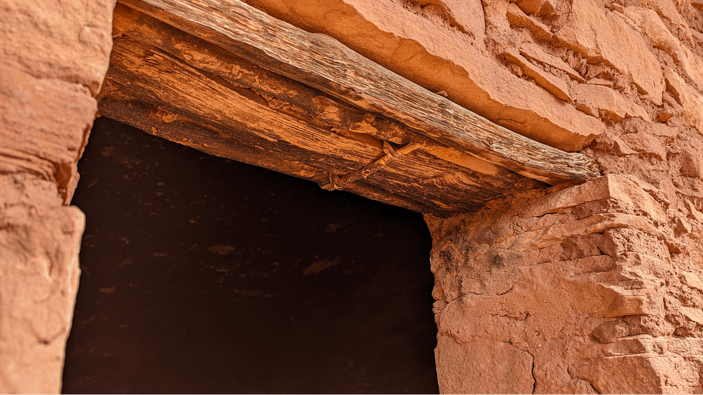 Wooden lintel in an ancient stone wall.