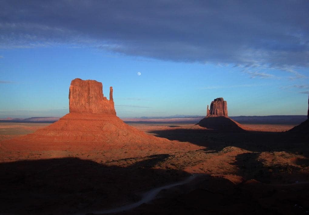 Dark shadows and red rock formations.