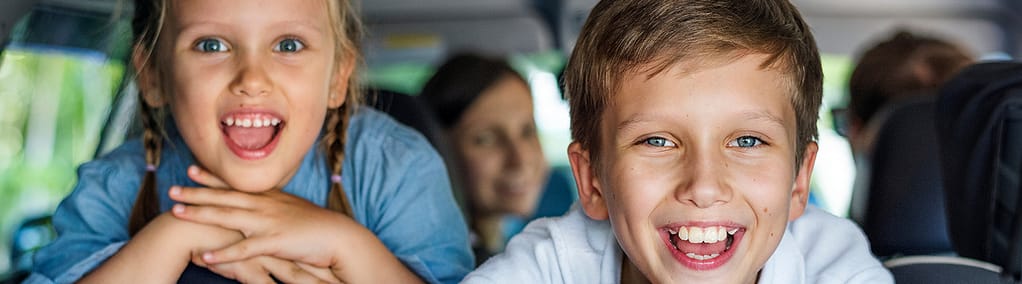 Kids smiling after a visit to the dentist.
