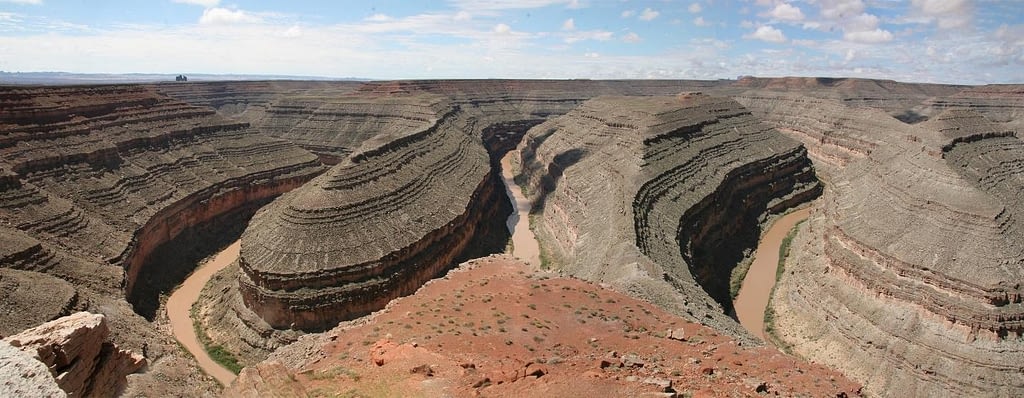 Winding grey canyons over a river.