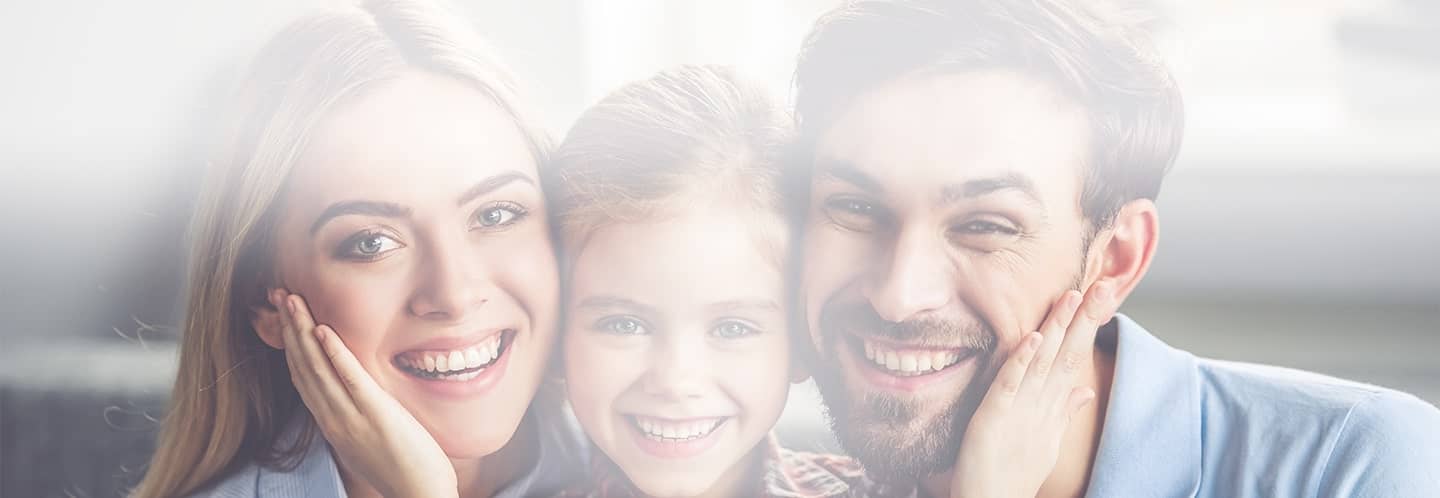 family with healthy teeth smiling