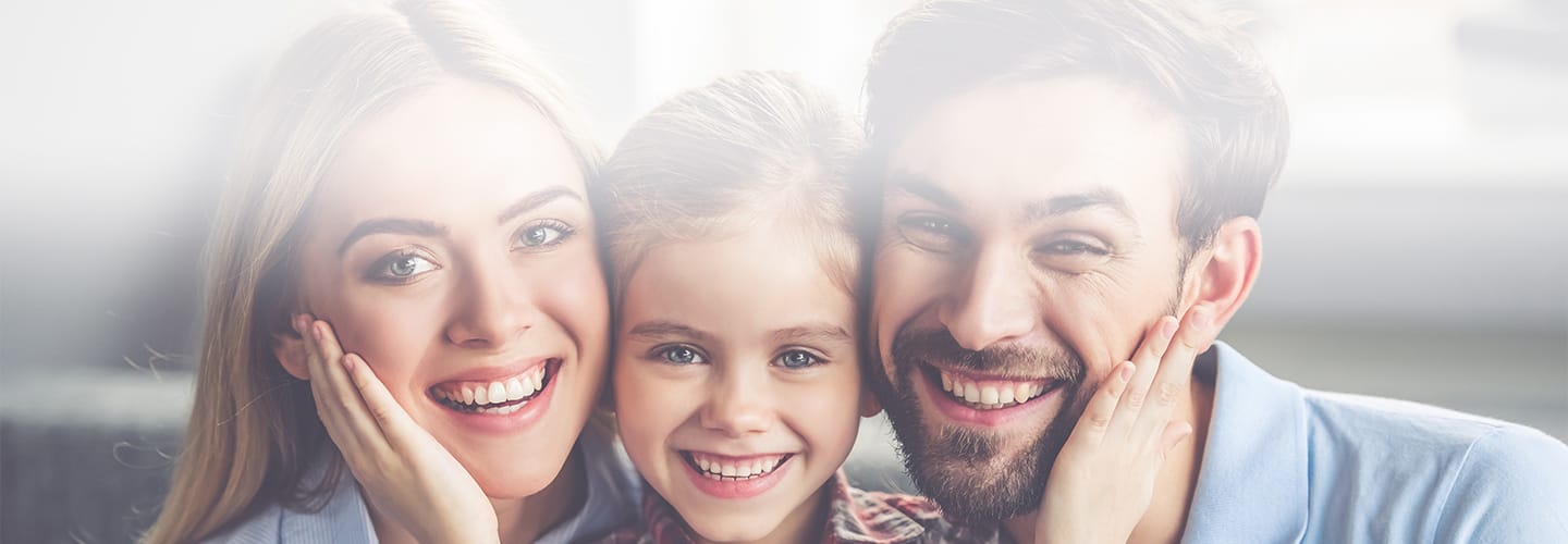 family with healthy teeth smiling