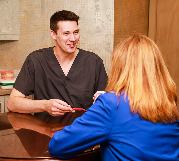 Green Bay Family Dentist, Dr. Adam Koch D.D.S. with woman patient